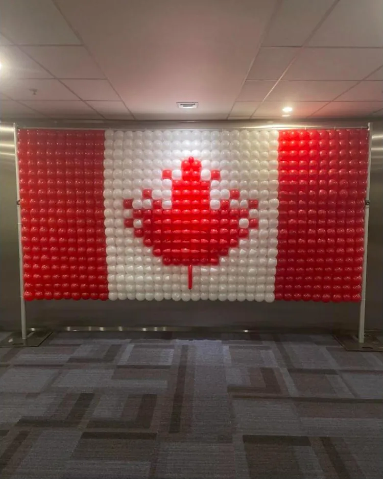Red and white balloon grid wall forming the Canadian flag